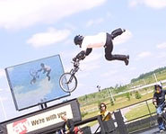 Photo of Dave Mirra doing a BMX trick on his bike at the X Games.