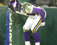 Randy Moss mimics a moon at Lambeau Field.
