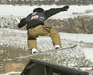 Shaun White rides a rail in the Snowboarding Slopestyle event at the Winter X Games.