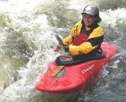 Picture of someone taking a kayak trip down a river.