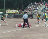 A umpire makes a call during a game of softball.