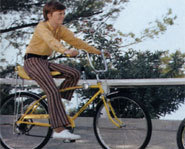 Picture of cyclist riding a new bicycle.