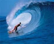 Danny Fuller rides a wave. He's one of seven surfers on the new reality surfing series, Boarding House.