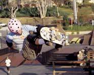 Skateboarder Cara Beth Burnside rides a vert ramp while wearing a Barbie Helmet.