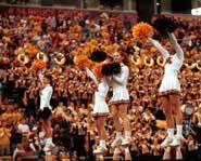 Picture of cheerleaders performing a routine at a game.