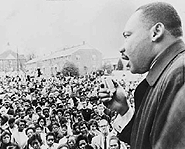 Martin Luther King, Jr. giving a speech to his many followers.