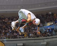 Bucky Lasek hits some big air in the vert ramp at the X Games.