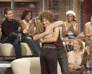 Kelly Clarkson and Justin Guarini share a hug after a performance on American Idol.