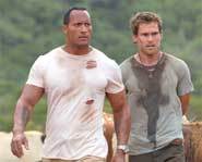 The Rock stars in the action movie, The Rundown, with Seann William Scott and Rosario Dawson.
