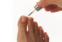 Before giving yourself a pedicure, soak your feet in warm water and use a pumice stone to remove calluses.