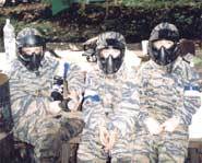 Paintball equipment includes goggles, facemask and camouflage clothing.