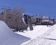 Pro snowboarder Tara Dakides gets air at an X Games Slopestyle event.
