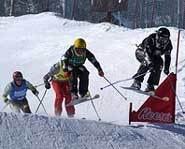 Aleisha Cline flies over a jump in the Skier X at the 2004 Winter X Games.