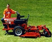 Ryan with one of his many donated lawnmowers.