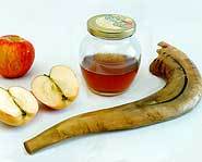 A shofar, apples and honey.