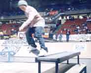 Skateboarder does a nose grind at the 2002 Slam City Jam.