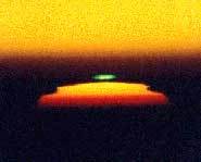 The green flash happens when part of the sun suddenly changes color.
