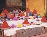 Local merchants sell powdered paint for Holi celebrations.