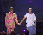 Awe - Em and Elton holding hands.