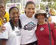 Natalie Williams and two fans at the WNBA All-Star Summer Jam.