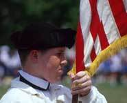 American flag being carried on July fourth.
