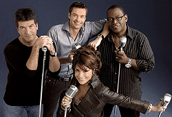 Ryan Seacrest hosts American Idol, where hopeful contestants get judged by Simon, Paula and Randy.