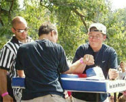 Photo of arm wrestling competition.