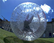 Picture of someone zorbing.