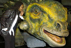 Whoopi Goldberg makes a new friend at Walking With the Dinosaurs.