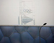 A thick layer of smog covers the Olympic logo.