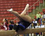 The Olympic balance beam is 16 feet, 3 inches long and 4 inches wide.